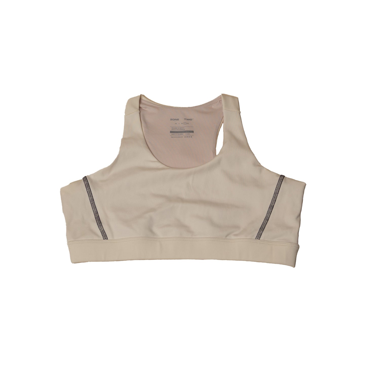 The CTRL Sports Bra in bone laid flat, front view, with a wide underband.