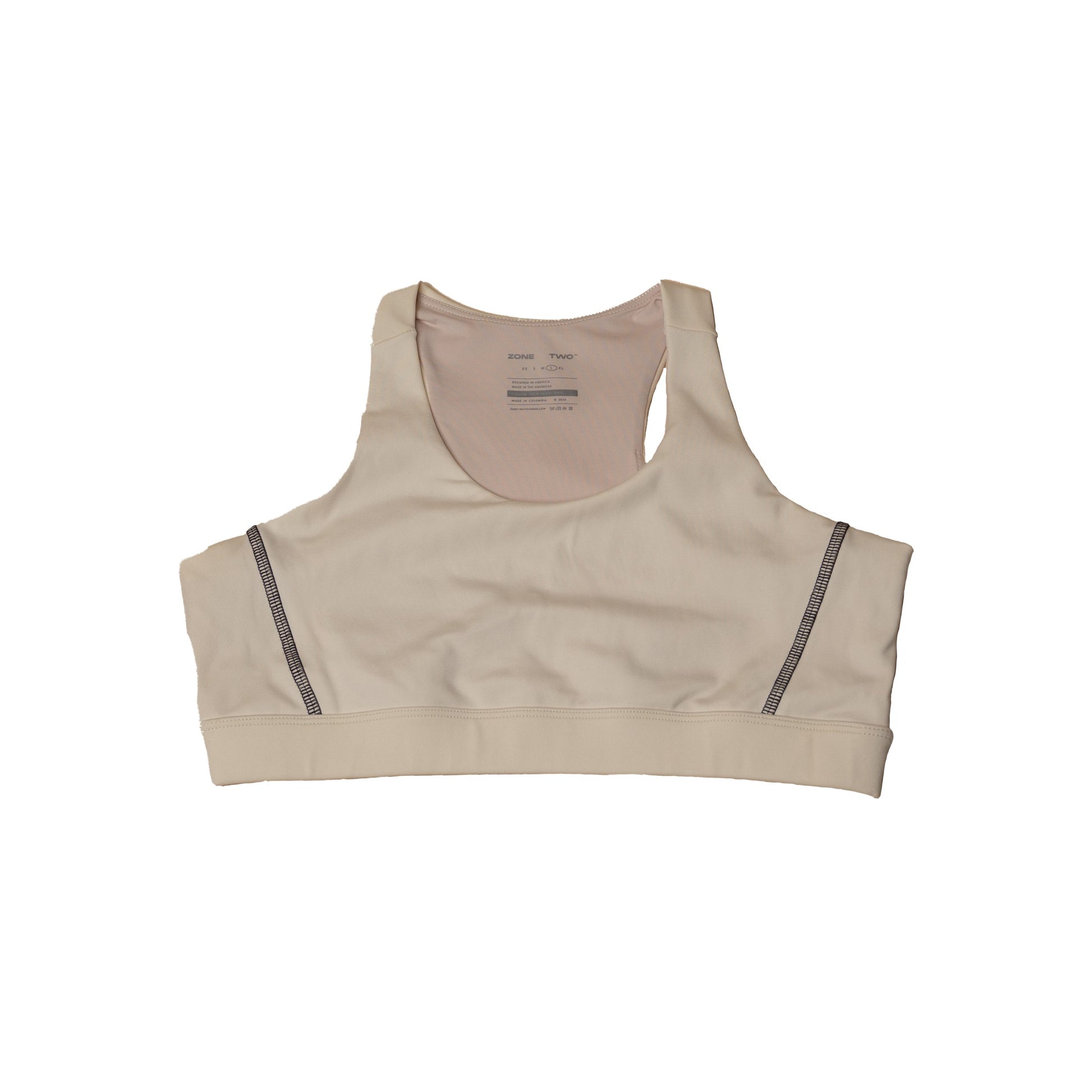The CTRL Sports Bra in bone laid flat, front view, with a wide underband.