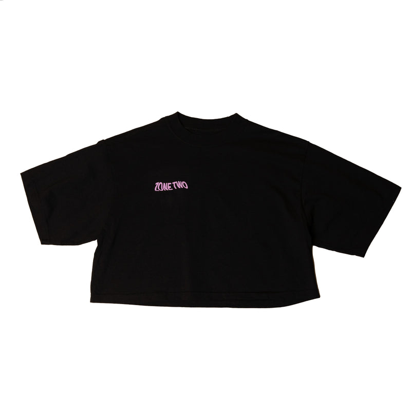 The Balance Crop laid flat in black, with a small red mark at the left chest.