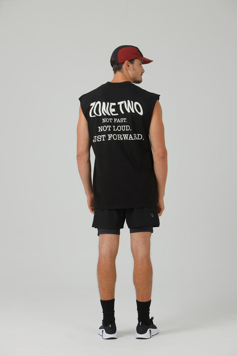 A man seen from behind in the black Forward Tank and a burgundy cap, showing the back print.
