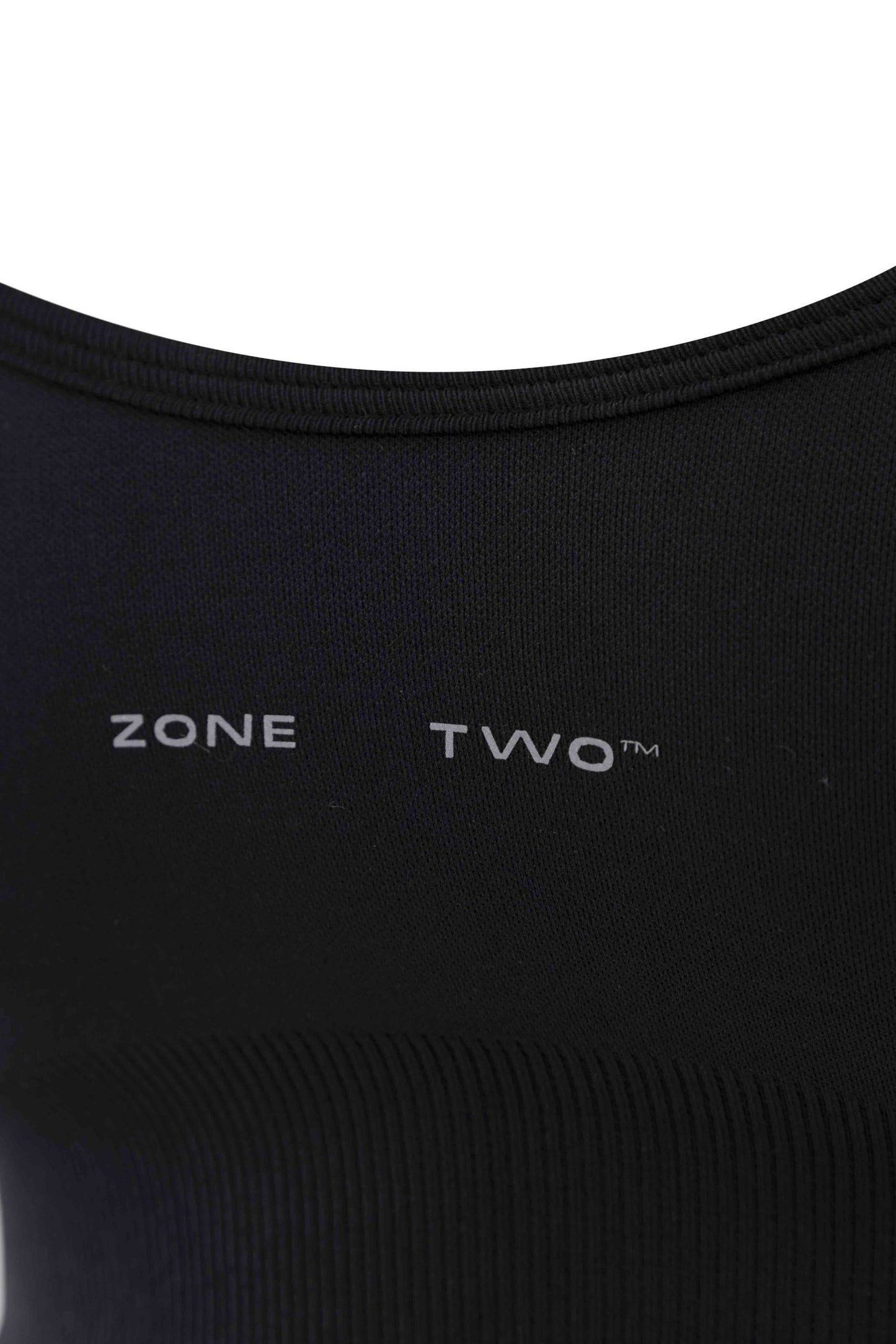 Close-up of the black Top Flow Racerback showing the Zone Two wordmark across the chest.