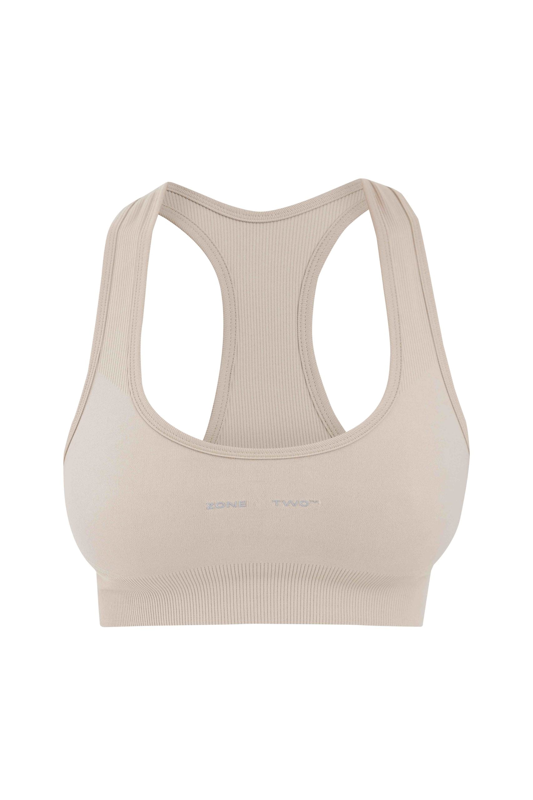 Beige Top Flow Racerback sports bra, front view, laid flat on white.
