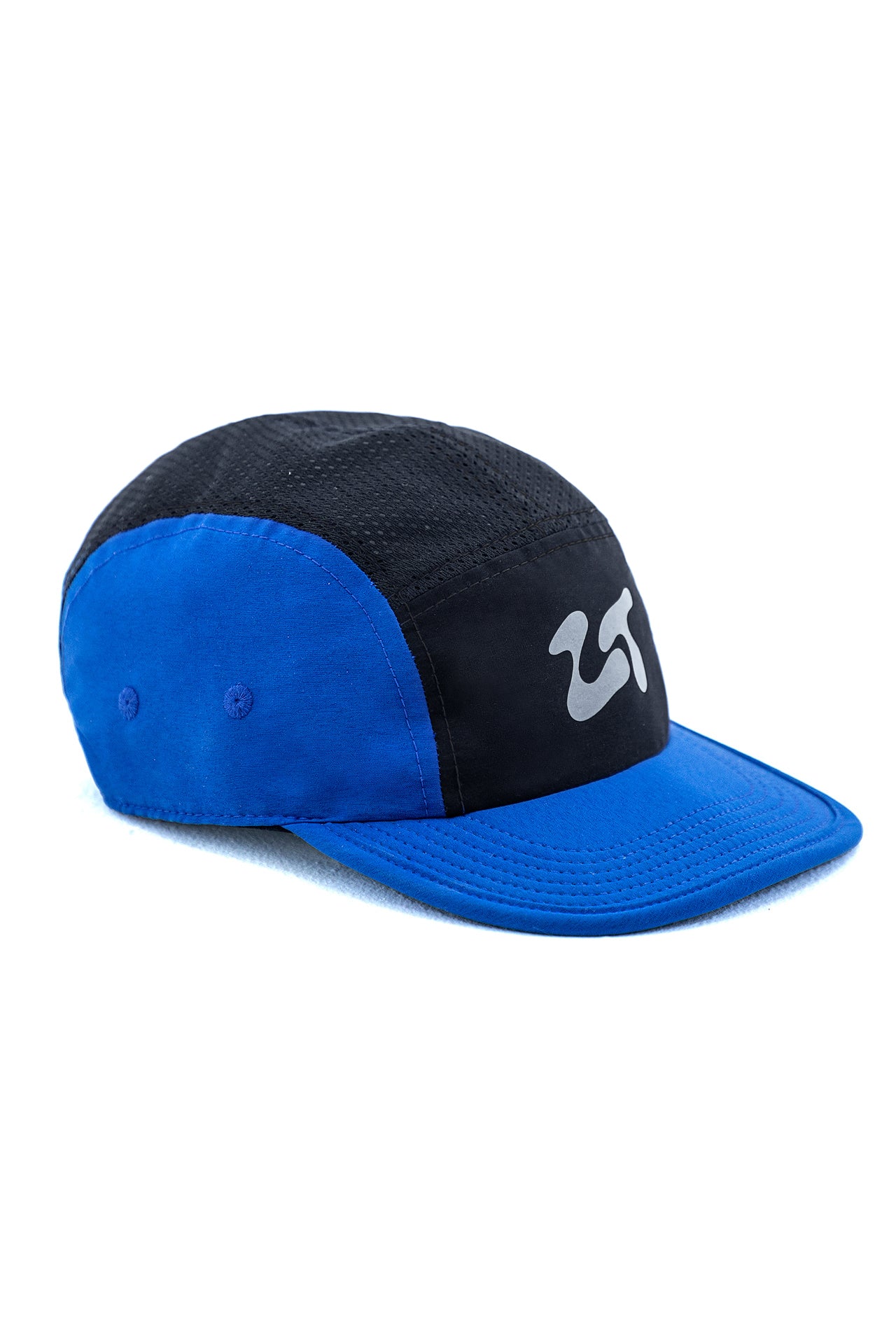 The Float Cap in the Blue colourway, angled to show the curved brim and royal blue crown panel.