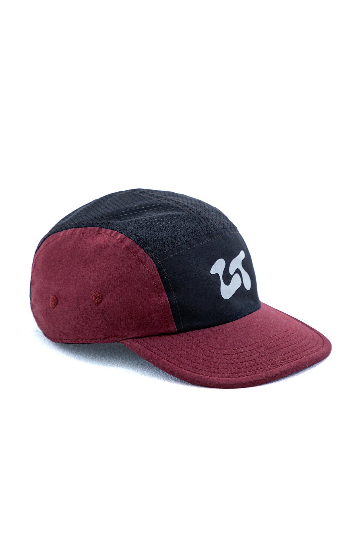 The Float Cap in the Red colourway, angled to show the curved brim and burgundy side panel.